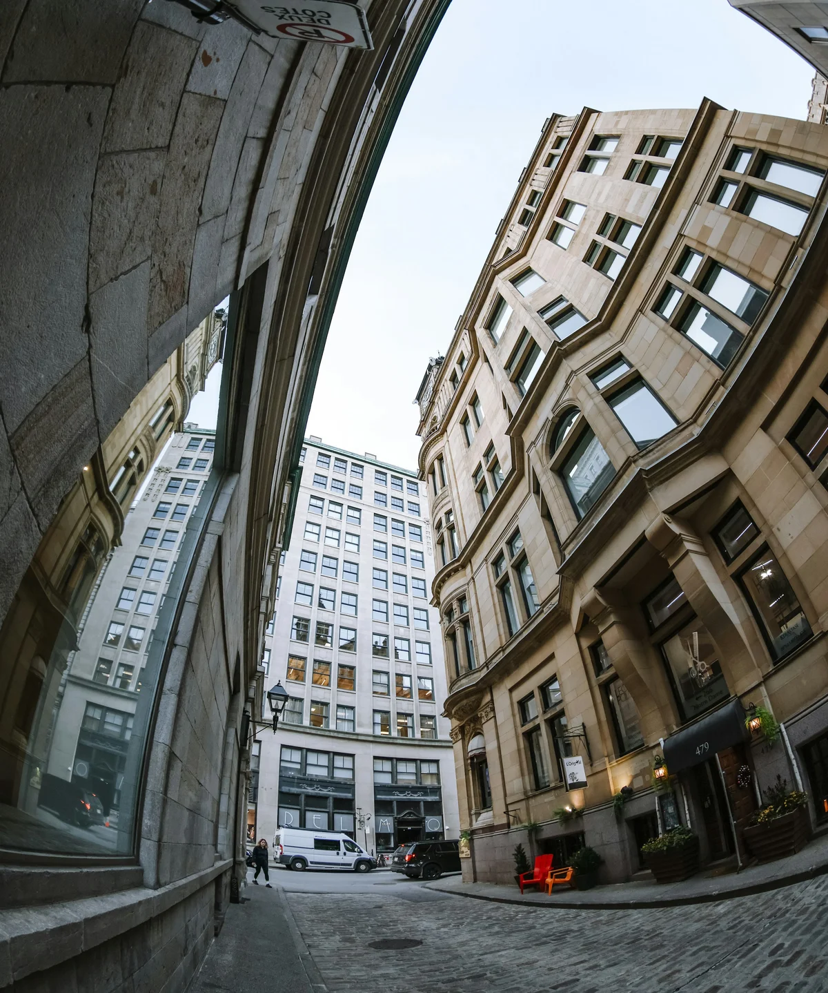 Building photo before perspective correction — verticals lean inward from wide-angle distortion