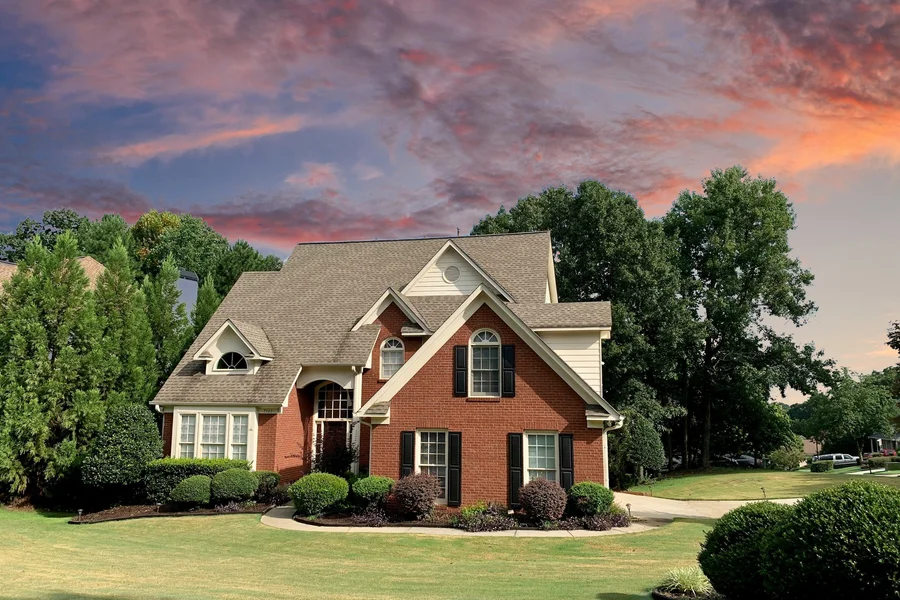 Overcast sky replaced with clear blue in a real estate exterior photo